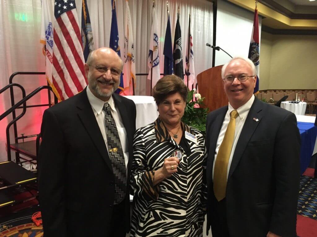 Veterans Home Care’s Howard and Bonnie Laiderman visit with Lee J. Metcalfe, vice president at Daugherty Business Solutions and retired USN rear admiral.